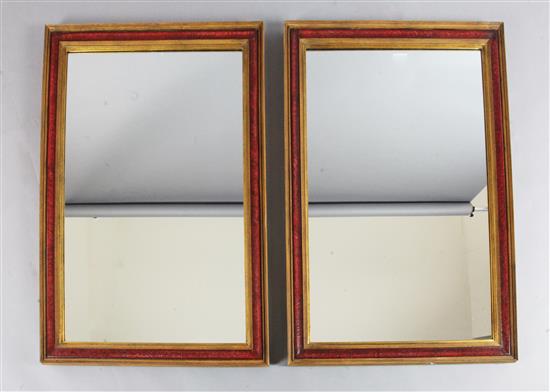 A pair of rectangular gilt and red lacquered wall mirrors